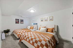 Carpeted bedroom with baseboards