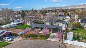 Aerial perspective of suburban area featuring a mountain backdrop