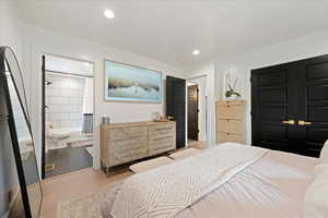 Bedroom with light wood-style flooring, a closet, and recessed lighting