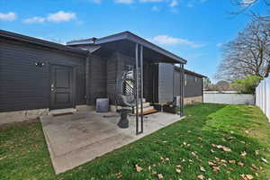 Back of property with a patio area