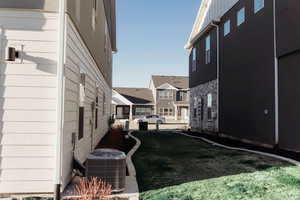 View of back/side of end unit property and yard