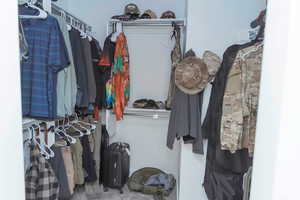 View of walk in master closet