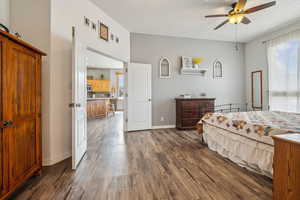 Bedroom with dark wood-style floors and ceiling fan