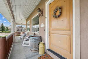 Property entrance with covered porch