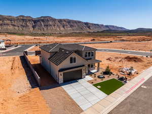 View of subject property with mountains and a desert landscape