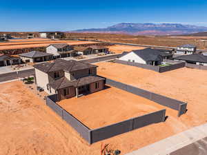 Aerial perspective of suburban area featuring a mountain backdrop