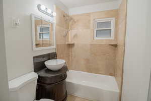 Full bath with vanity and shower / bath combination