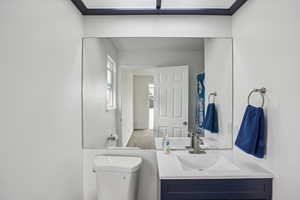 Bathroom with vanity and toilet
