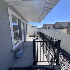 Fenced backyard with a deck