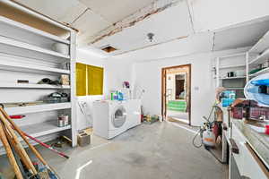 Below grade area featuring washing machine and dryer
