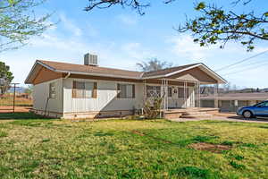 View of front facade featuring crawl space, a porch, a front yard, and roof with shingles