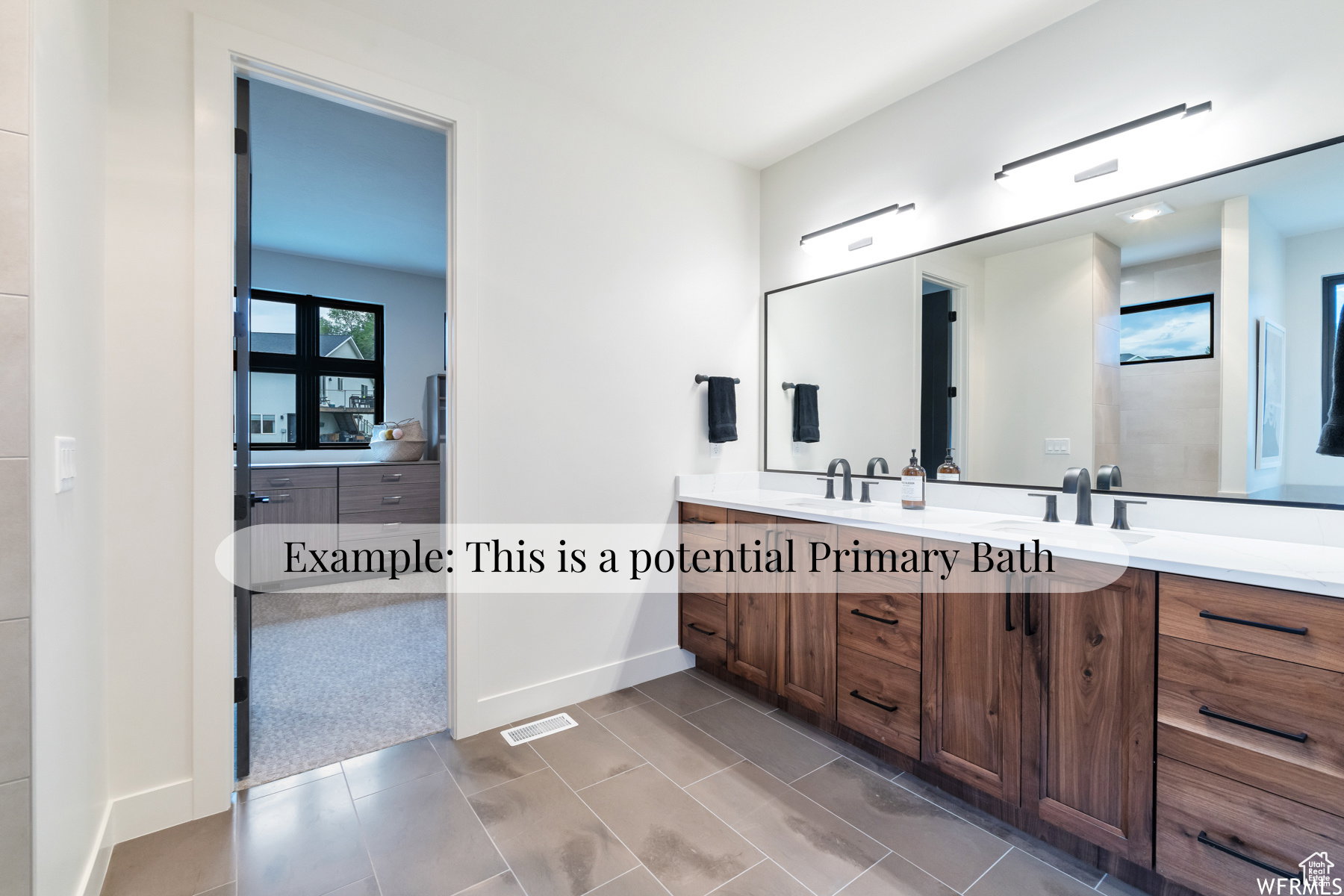 Full bathroom with double vanity and light tile patterned floors