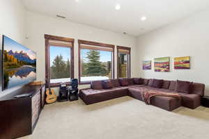 Living room featuring light carpet and recessed lighting