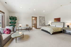 Bedroom featuring carpet floors, lofted ceiling, recessed lighting, and connected bathroom