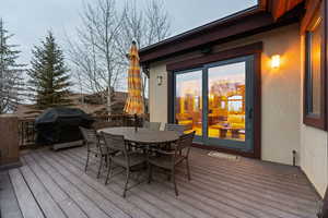 Deck featuring grilling area and outdoor dining space