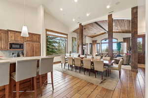 Dining space featuring light wood-type flooring, a vaulted wooden ceiling, and recessed lighting
