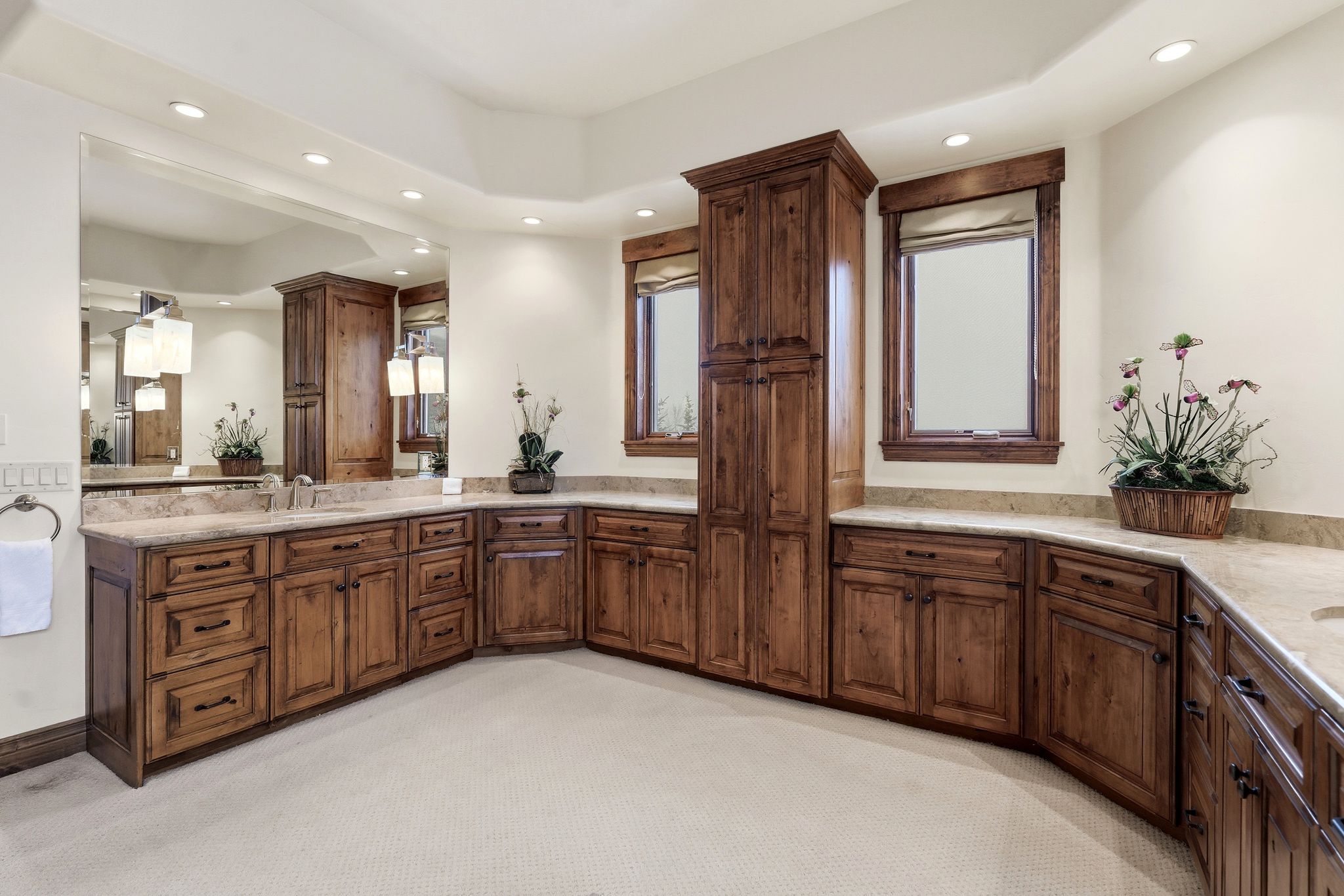 Full bathroom with vanity, a tray ceiling, light carpet, and recessed lighting