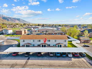 Aerial perspective of suburban area featuring a mountain backdrop