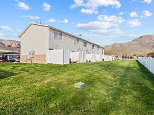 Rear view of property featuring a mountain view and brick siding