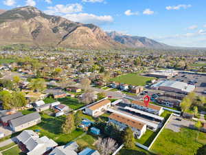 Aerial view of residential area featuring a mountain backdrop