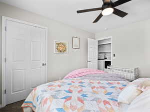 Bedroom with ceiling fan and carpet flooring