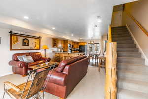 Living room with light carpet and recessed lighting