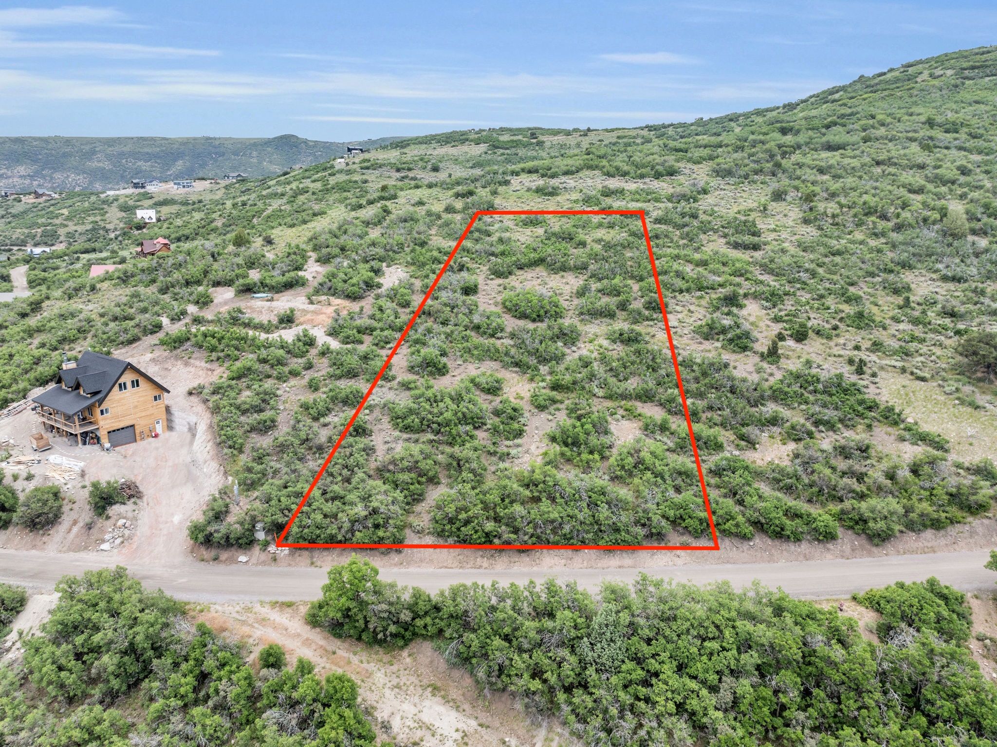 View of rural area featuring property boundaries highlighted and a mountain backdrop