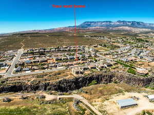 Aerial perspective of suburban area with a mountainous background