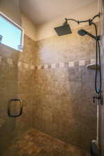 Full bath featuring a shower stall