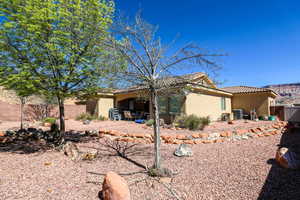View of property exterior featuring a patio area, stucco siding, and a tile roof