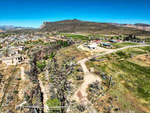 Aerial perspective of suburban area featuring a mountainous background