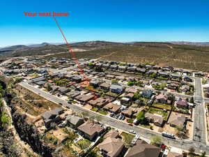 Aerial view of residential area featuring a mountain backdrop