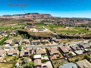 Aerial perspective of suburban area with a mountainous background
