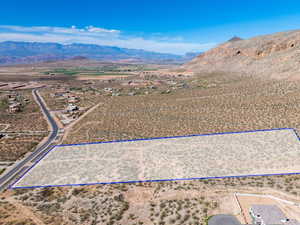 Overview of rural landscape featuring mountains and property parcel outlined