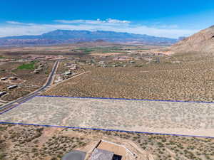 Overview of rural landscape featuring property parcel outlined and a mountainous background