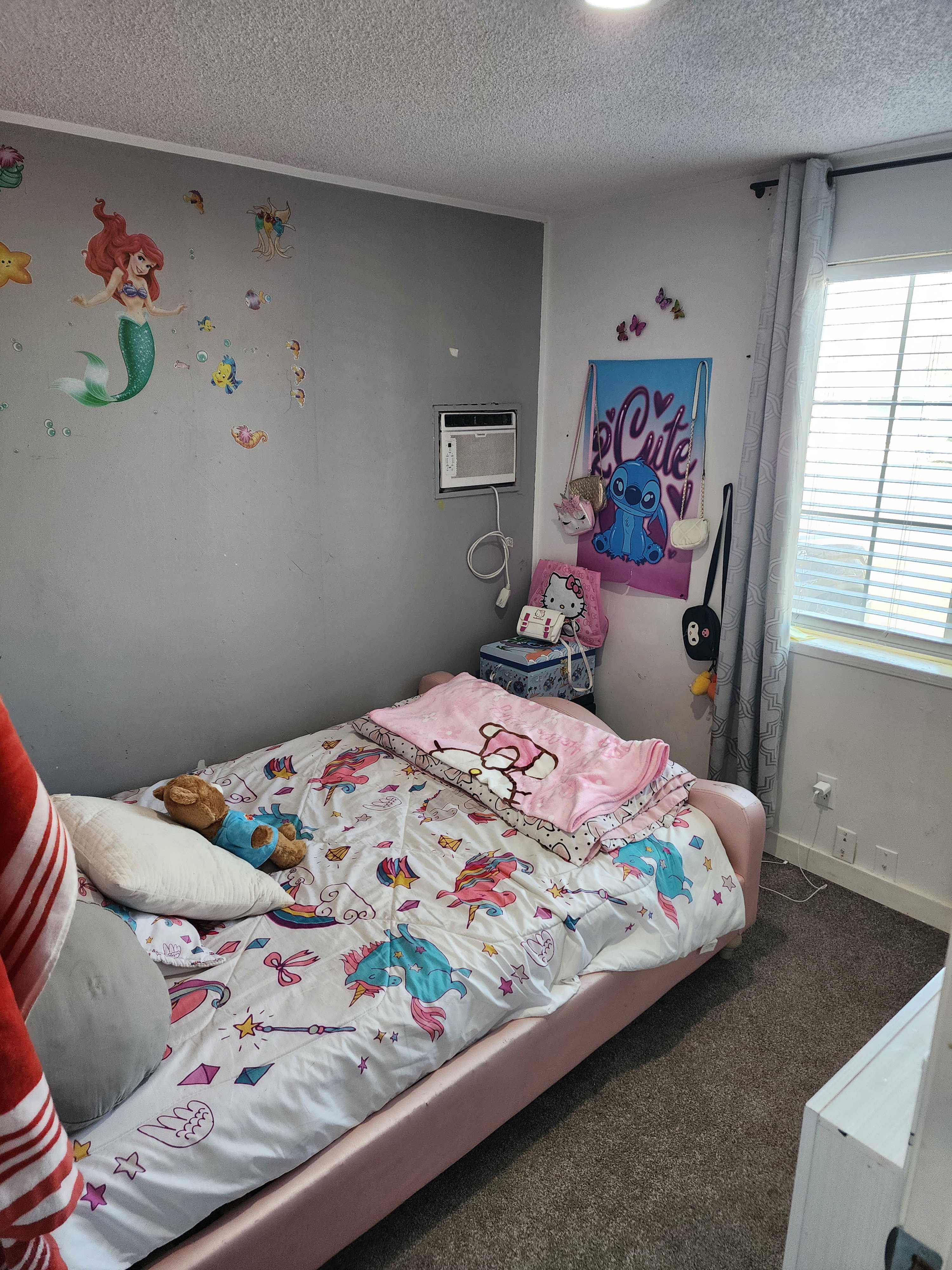 Bedroom featuring carpet flooring and a textured ceiling