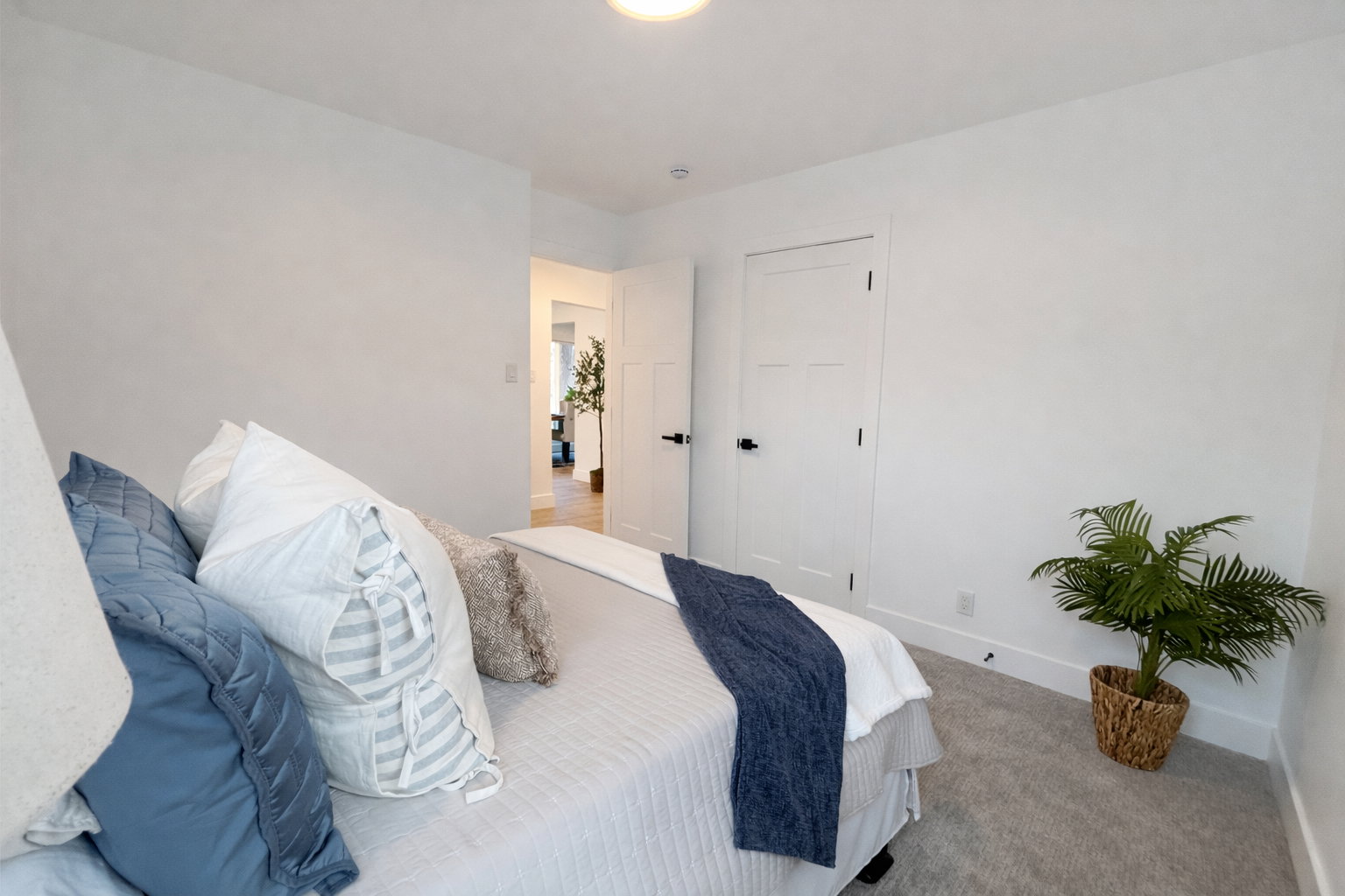 Carpeted bedroom featuring baseboards