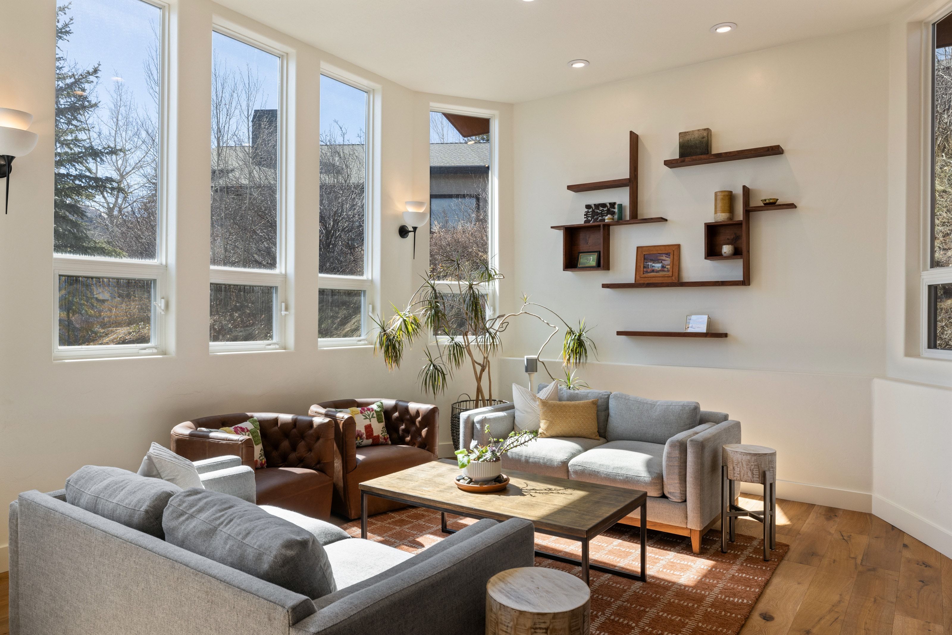 Living area with wood finished floors and recessed lighting