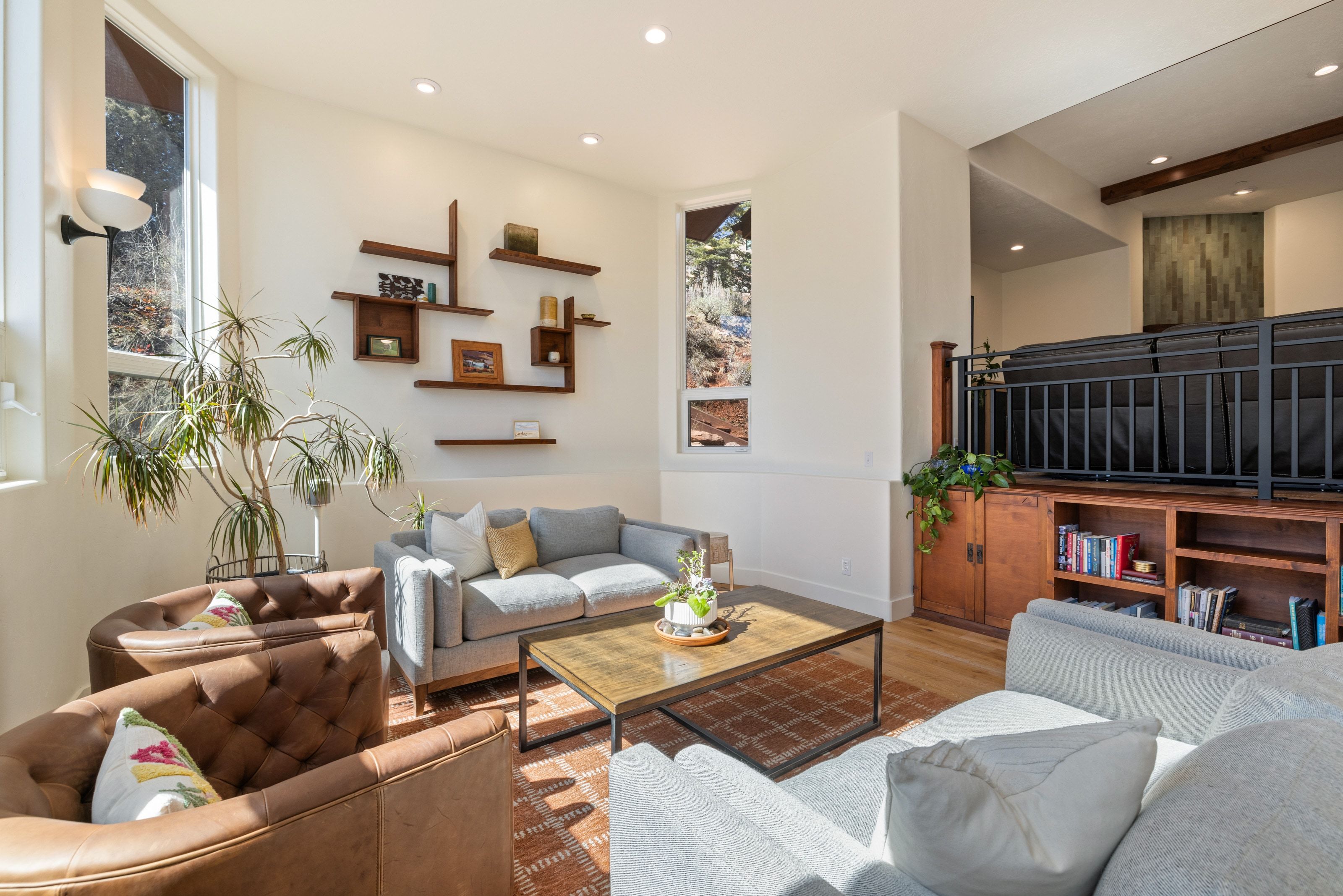 Living area featuring wood finished floors and recessed lighting