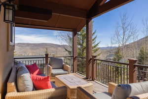 Wooden terrace with a mountain view and outdoor seating