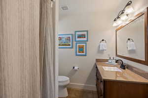 Full bathroom featuring vanity, a shower with curtain, and light tile patterned floors