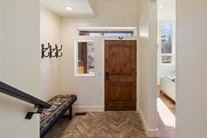 Entryway featuring parquet floors and plenty of natural light