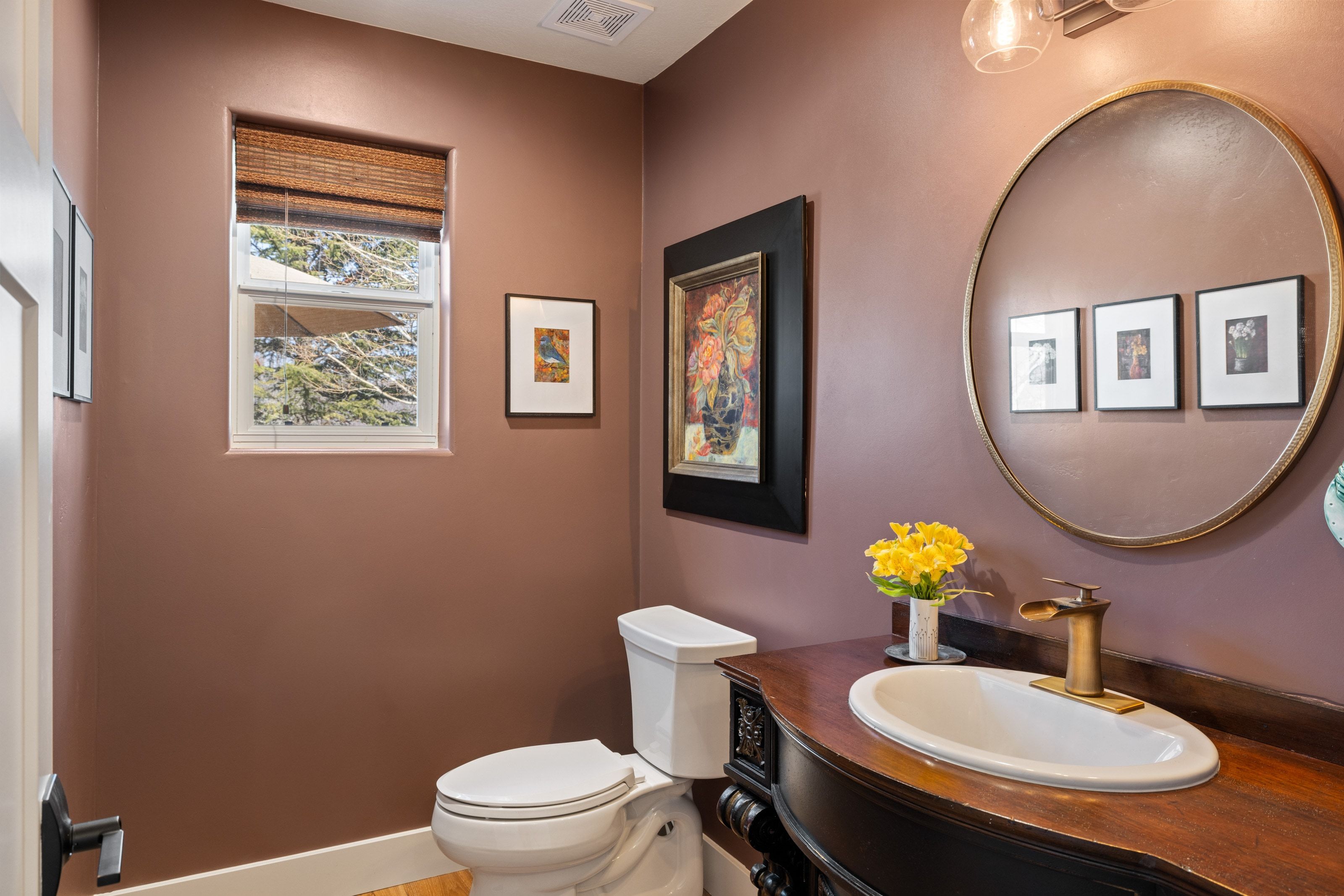 Half bathroom with toilet and vanity