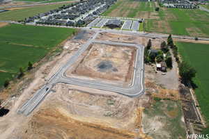 Aerial view of property's location featuring rural landscape and abundant farmland
