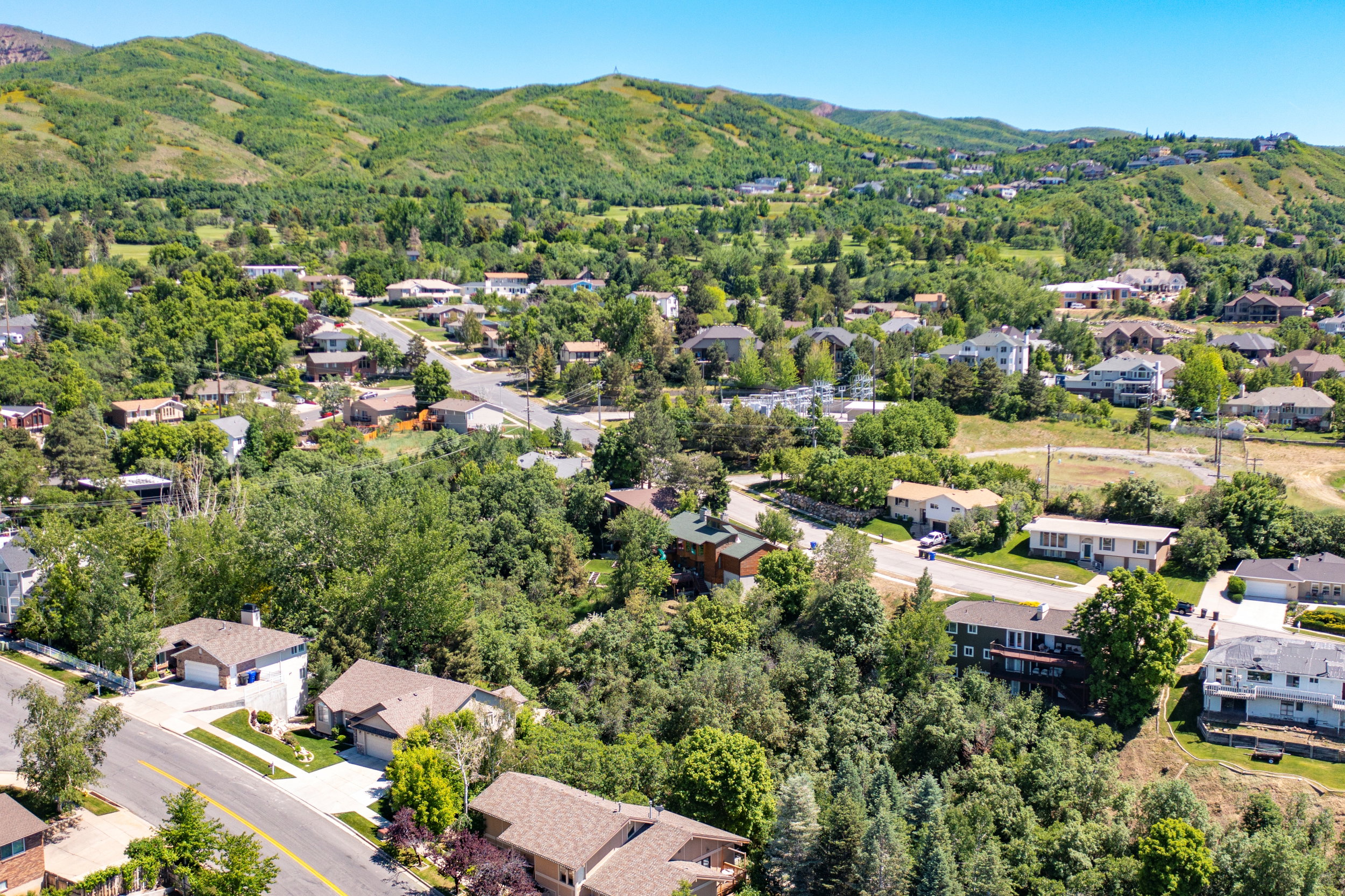 View of property location featuring a mountain backdrop and nearby suburban area