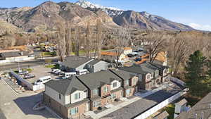 Aerial perspective of suburban area featuring a mountain backdrop