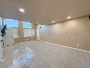 Main bedroom with private balcony and recessed lighting and baseboards