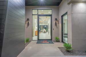 Property entrance with stucco siding