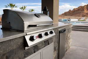 View of patio / terrace with an outdoor pool and exterior kitchen