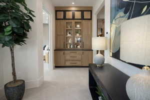 Hallway featuring baseboards and recessed lighting